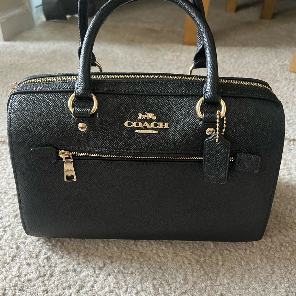 Coach Black Rowan bag slightly used, in excellent condition like new.